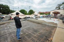 Chad Mathews looking at the destruction