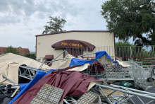 Tent down with hut in back